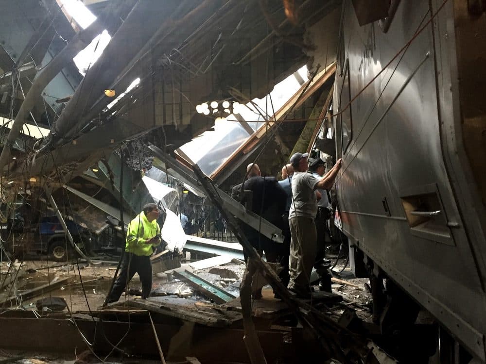 Train personnel survey the NJ Transit train that crashed in to the platform at the Hoboken Terminal on Sept. 29, 2016, in Hoboken, N.J. (Pancho Bernasconi/Getty Images)