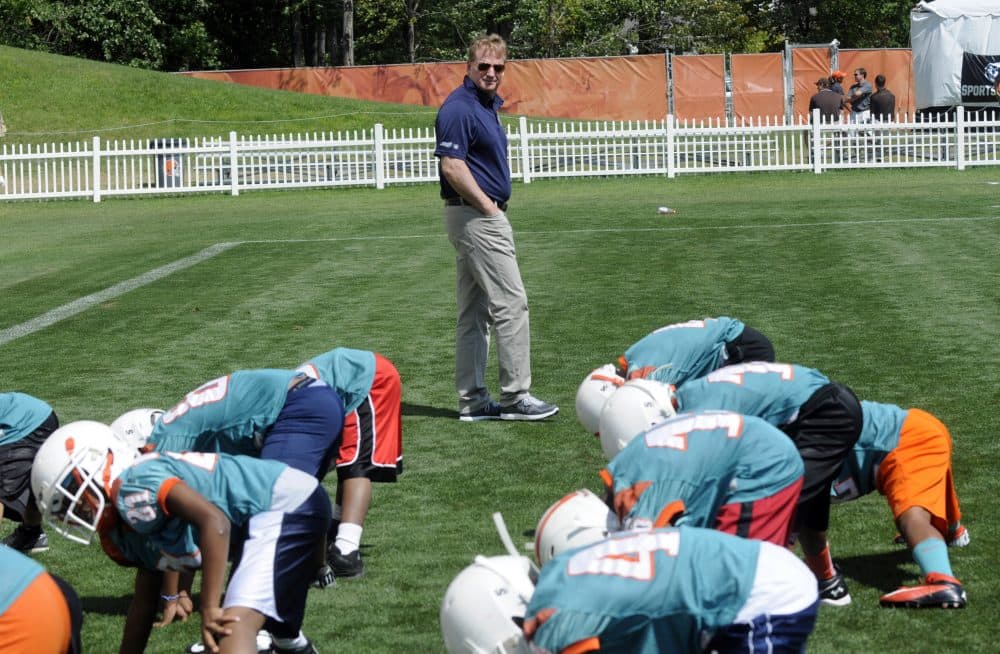 NFL commissioner Roger Goodell is seen at Heads Up Football skills clinic for youth football players from the Northeast Ohio Pop Warner Leagues in Berea, Ohio, back in 2013. Two mothers of deceased former youth football players have filed a lawsuit against Pop Warner and the NFL's youth football program. (Tom E. Puskar/AP for NFL Network)