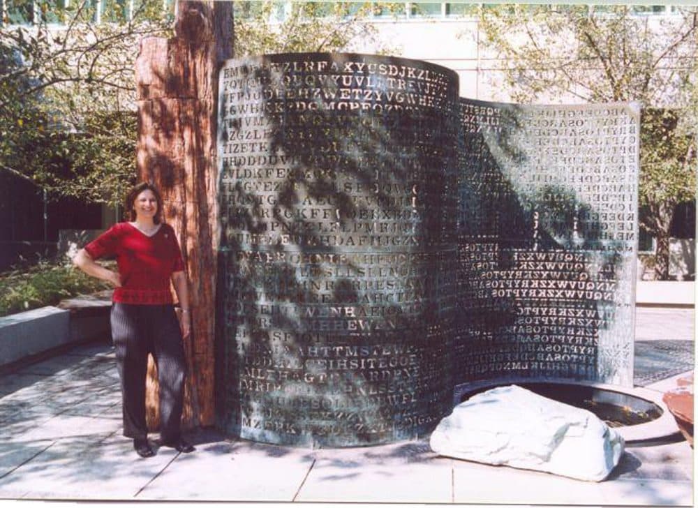 Elonka Dunin stands next to Kryptos in 2002, when she was allowed access to CIA's headquarters in Langley. (Courtesy of Elonka Dunin)