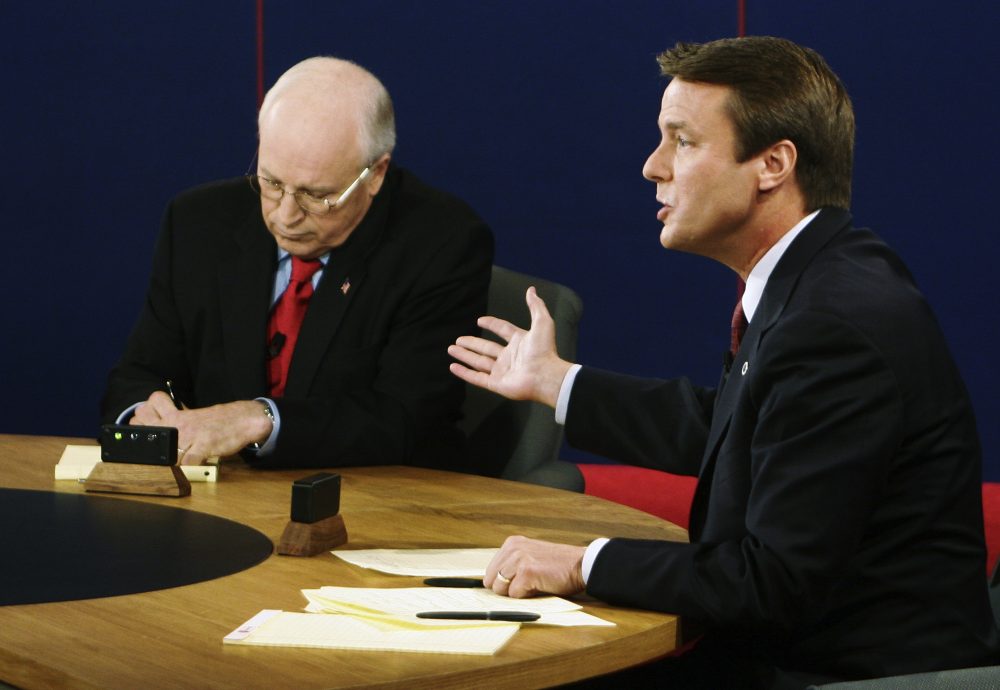 Vice President Dick Cheney takes notes as Democratic vice presidential candidate Sen. John Edwards speaks during their vice presidential debate at Case Western Reserve University in Cleveland on Tuesday, Oct. 5, 2004. (Rick Wilking/AP)