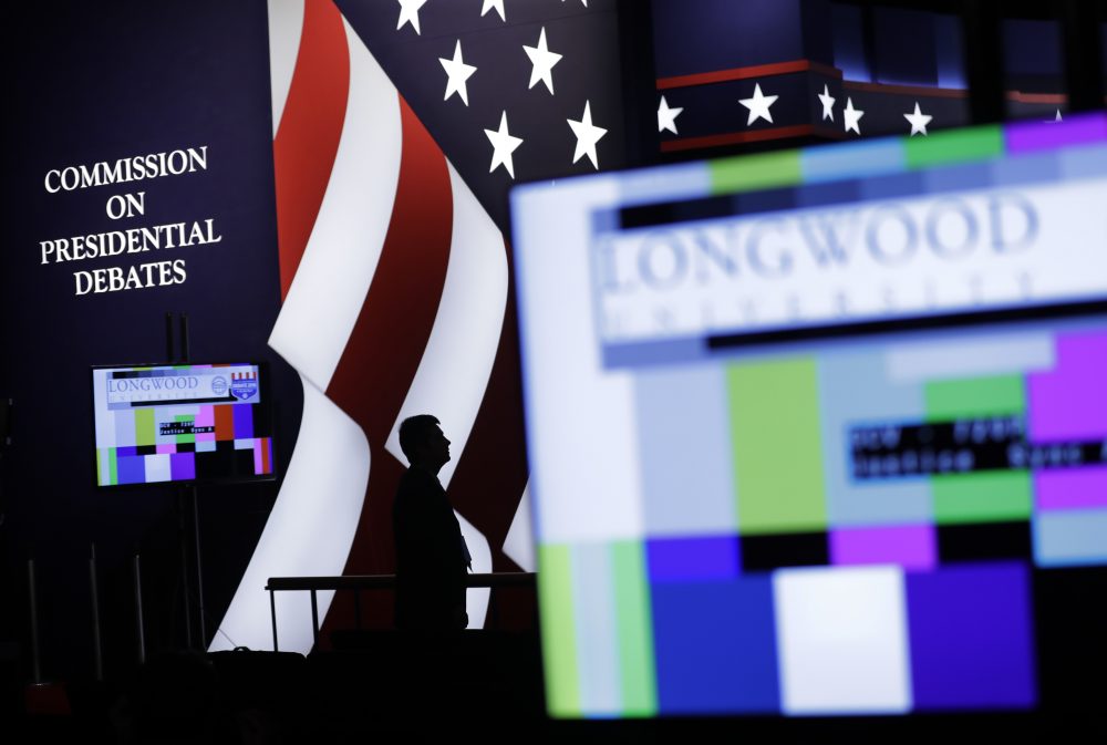 An official stands on stage during preparations for the vice-presidential debate between Republican vice-presidential nominee Gov. Mike Pence and Democratic vice-presidential nominee Sen. Tim Kaine at Longwood University in Farmville, Va., Monday, Oct. 3, 2016. (Patrick Semansky/AP)