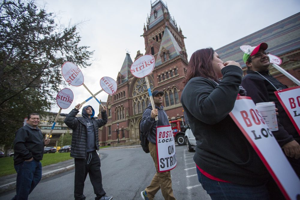 Dining service workers picket outside Harvard's Memorial Hall earlier this month. (Jesse Costa/WBUR)
