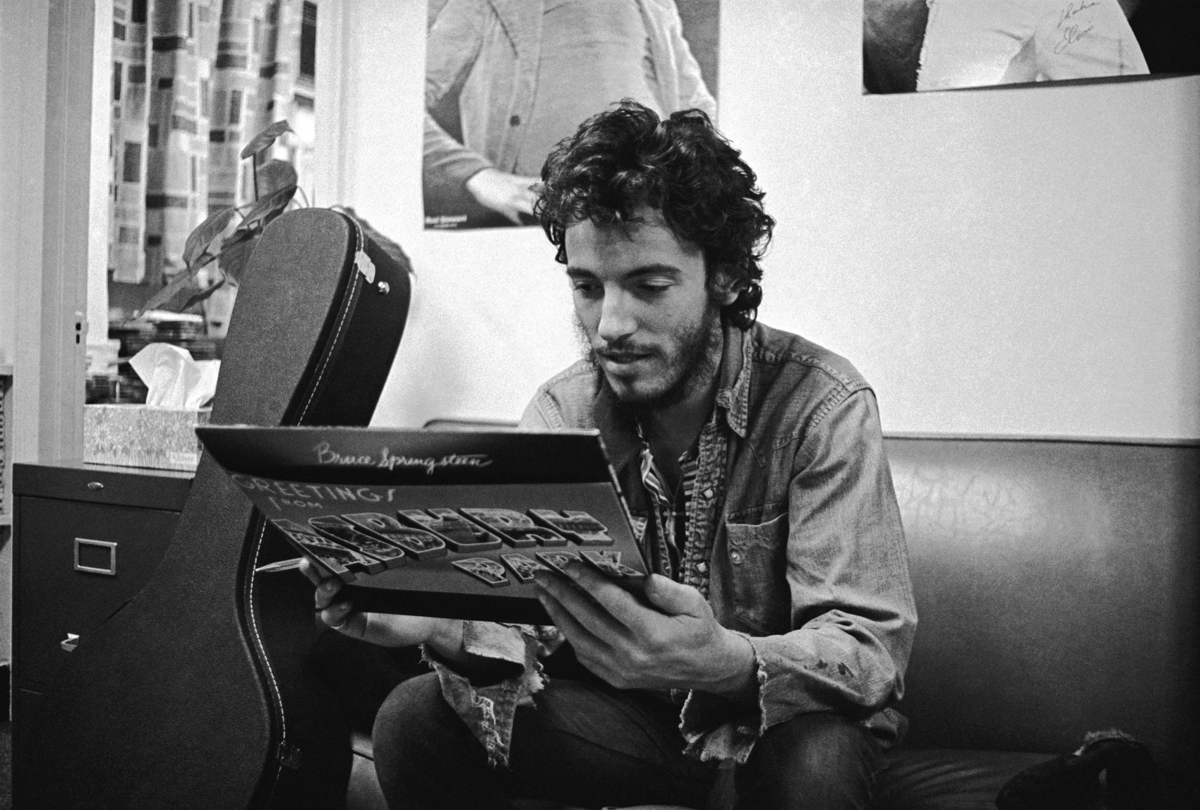 Bruce Springsteen looking at his first album for the first time. (Courtesy Art Maillet)
