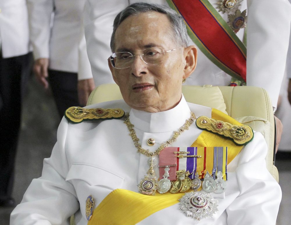 In this Dec. 5, 2011, file photo, Thailand's King Bhumibol Adulyadej is pushed on a wheelchair while leaving Siriraj hospital for the Grand Palace for a ceremony celebrating his birthday in Bangkok. (Apichart Weerawong/AP)