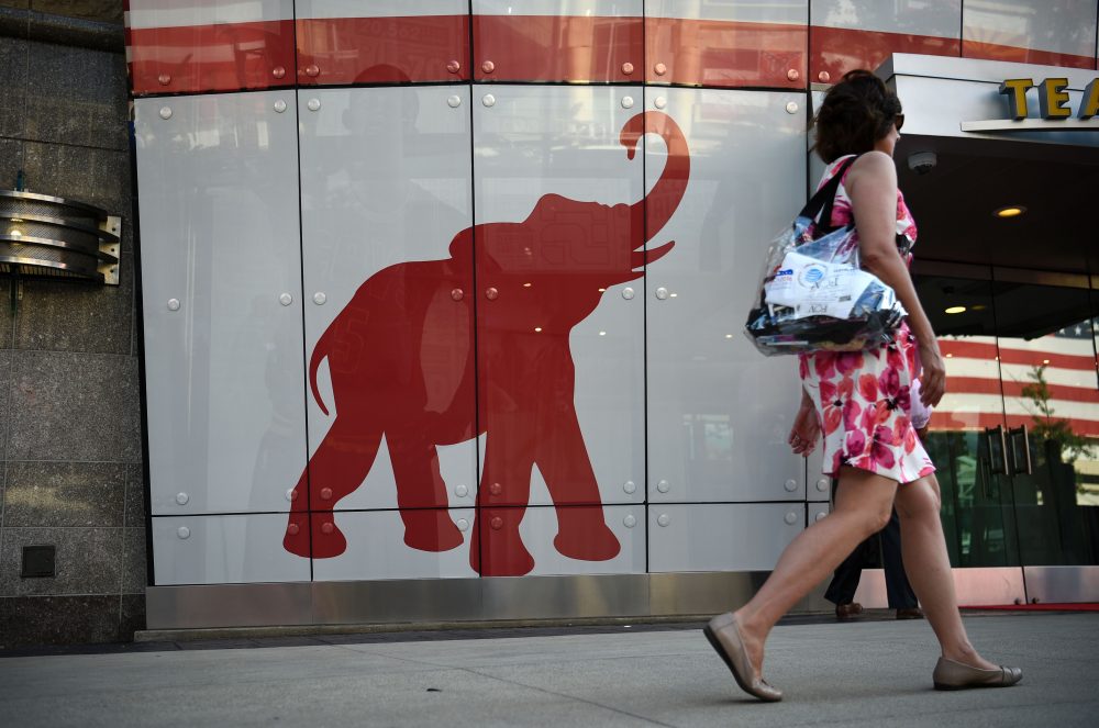 A woman walks past the elephant logo of the Republican Party on the first day of the Republican National Convention on July 18, 2016 in Cleveland, Ohio. (Dominick Reuter/Getty Images)