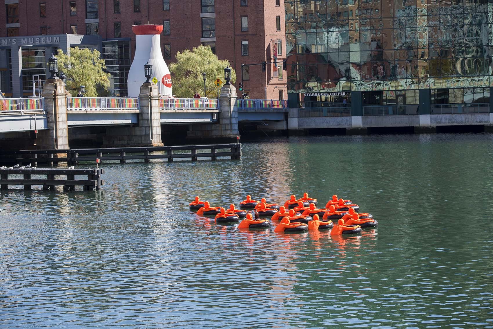 &quot;SOS (Safety Orange Swimmers)&quot; as seen in the Fort Point Channel. (Jesse Costa/WBUR)