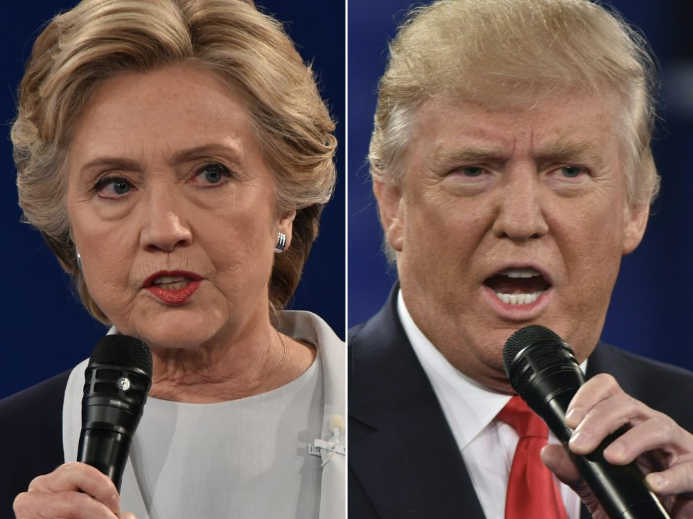 This combination of pictures shows Democratic presidential candidate Hillary Clinton and Republican presidential candidate Donald Trump during the second presidential debate at Washington University in St. Louis, Missouri on Oct. 9, 2016. (Paul J. Richards/Getty Images)