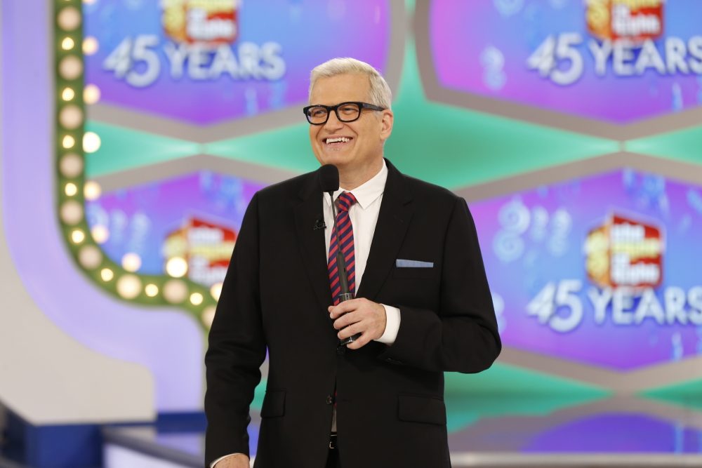 On the episode of &quot;The Price is Right&quot; airing Monday, Oct. 17, 2016, a trio of contestants spun $1 on the game show's famous wheel. The three contestants each landed on different combinations of $1 in a pair of spins during one of the show's &quot;Showcase Showdowns.&quot; Host Drew Carey pumped his fist in the air after the contestants achieved the first three-way tie in the show's history. (Monty Brinton/CBS via AP)