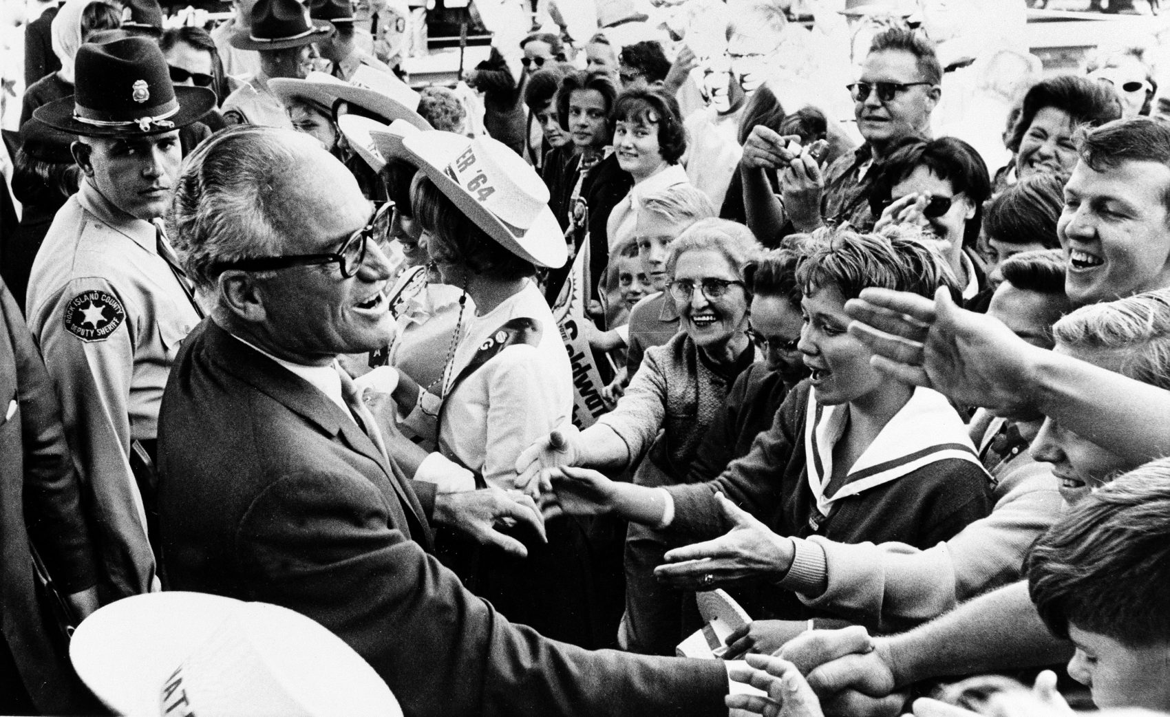 Republican presidential candidate Barry Goldwater greets supporters during a whistle-stop tour of Rock Island, Ill., on Oct. 3, 1964. (Henry Burroughs/AP)