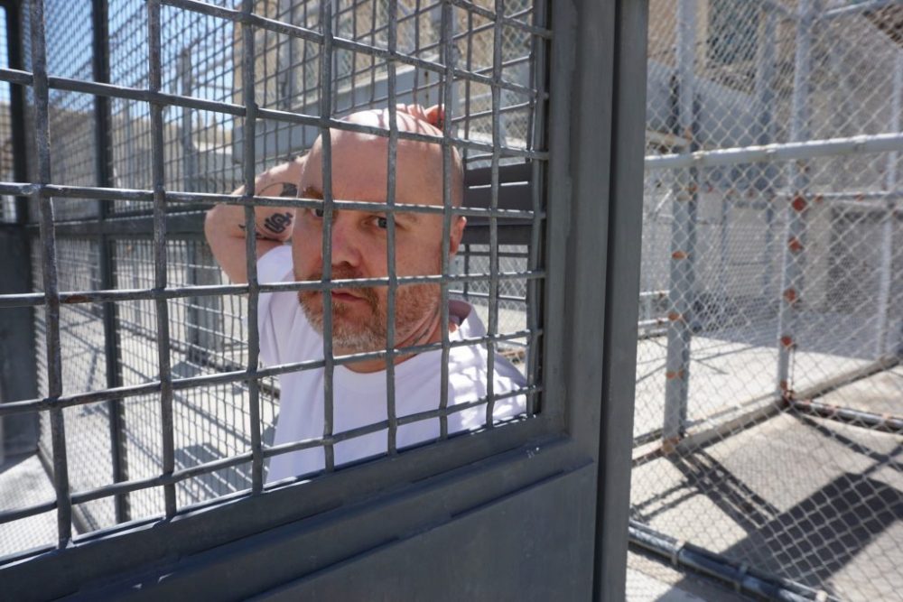Death row inmate Joseph Perez in a San Quentin exercise cage. He was sentenced to death for helping to kill a Contra Costa County housewife with two others in 1998. Perez denies his guilt, but is afraid he’ll die at San Quentin, if not from execution than old age. (Saul Gonzalez/KCRW)