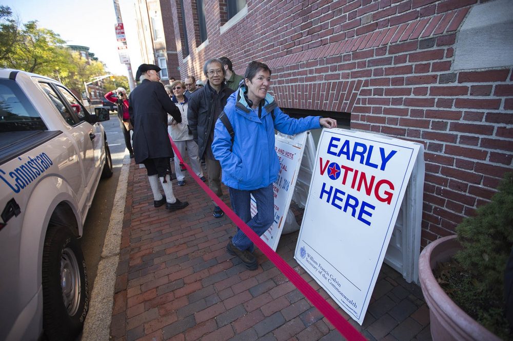 Voters in Cambridge wait in line on the first day of early voting -- Monday, Oct. 24. (Jesse Costa/WBUR)