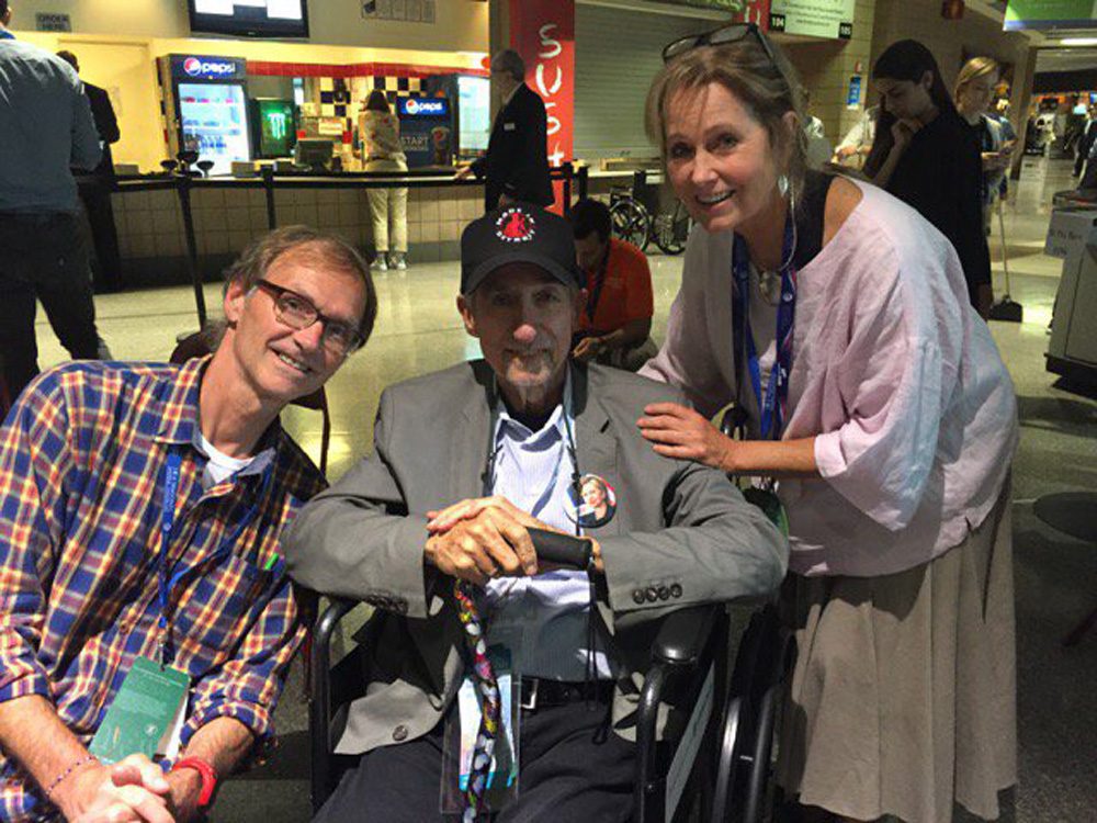 Here & Now producer Alex Ashlock (left) and host Robin Young (right) spoke with Tom Hayden at the 2016 Democratic National Convention. (Robin Young/Here & Now)