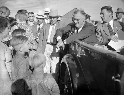 President Franklin Roosevelt, pictured getting drought information first-hand in his car as he talked with farmer Will Duerr and his family in Julesburg, Colo. on Sept. 3, 1936. Roosevelt won the state in the 1932 and 1936 presidential elections. (AP)