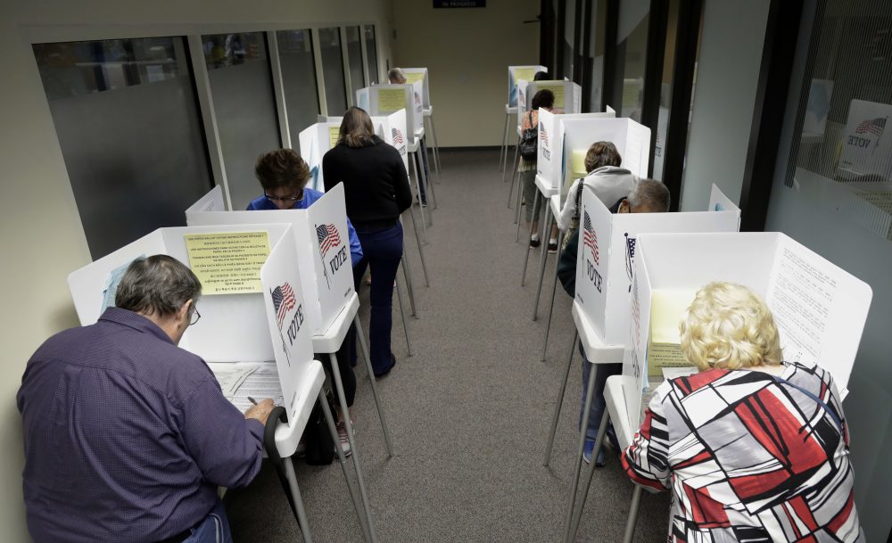 Voters cast their ballots at the Santa Clara County Registrar of Voters on Monday, Oct. 24, 2016, in San Jose, Calif. (Marcio Jose Sanchez/AP)