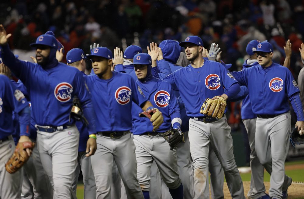 The Chicago Cubs celebrate after Game 2 of the Major League Baseball World Series against the Cleveland Indians Wednesday, Oct. 26, 2016, in Cleveland. (David J. Phillip/AP)