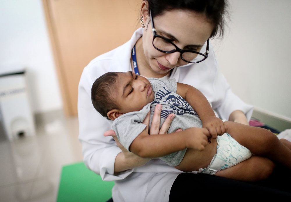Dr. Stella Guerra performs physical therapy on an infant born with microcephaly at Altino Ventura Foundation on June 2, 2016 in Recife, Brazil. (Mario Tama/Getty Images)