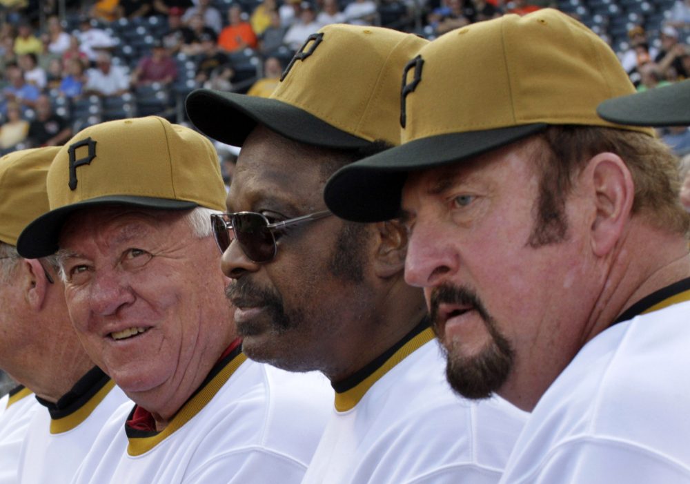 Al Oliver, center, and Bob Robertson, right, played first base for the Pirates in 1971. On Sept. 1, Oliver got the start instead of Robertson -- and MLB history was made. (Gene J. Puskar/AP)