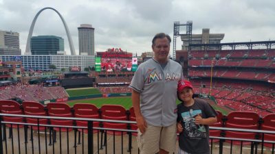 Dave and Tommy MacDougall, pictured here at Busch Stadium in St. Louis, are halfway through their journey to spread Johnny's ashes at every ballpark across the country. (Courtesy of Dave MacDougall)