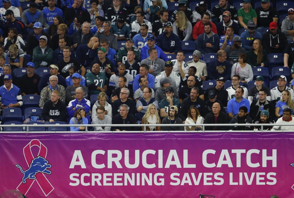 A breast cancer awareness sign is shown during an NFL game between the Detroit Lions and Philadelphia Eagles in Detroit on Sunday. (Paul Sancya/AP)