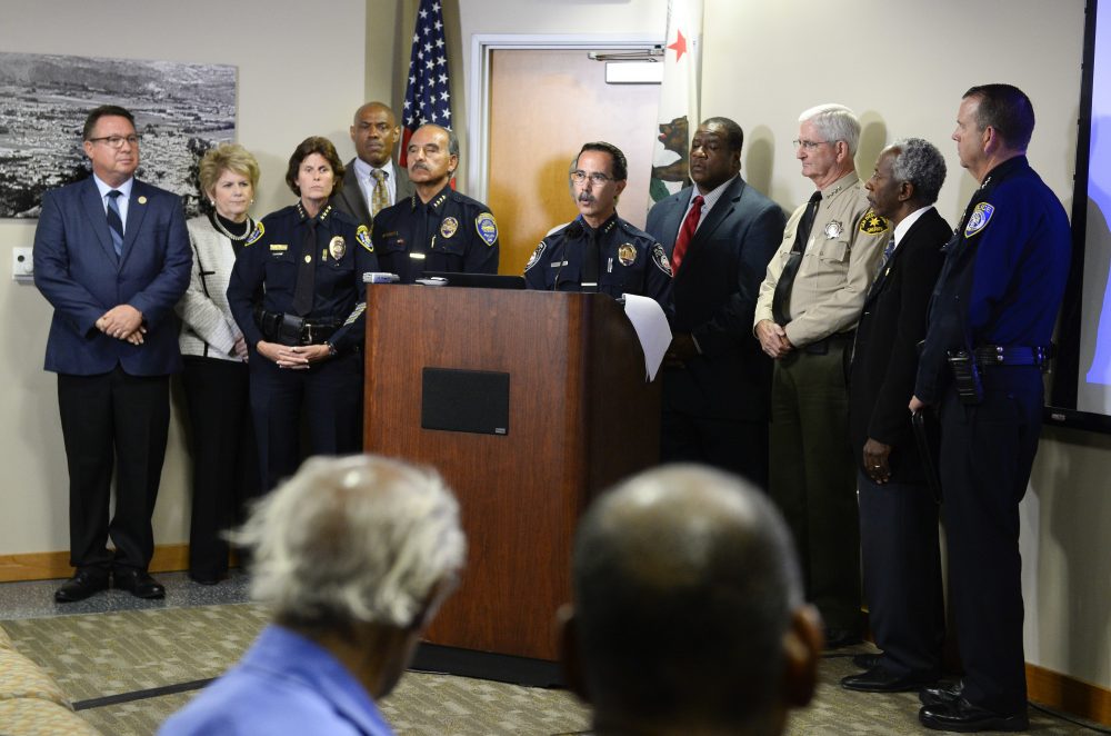 El Cajon Police Department Capt. Jeffery Davis, center, speaks at a news conference on Sept. 30, 2016, held to address the killing of Alfred Olango, a Ugandan refugee shot by an El Cajon police officer on Tuesday. (Denis Poroy/AP)