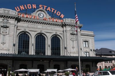 Denver Union Station in the district of LoDo. The historic terminal building includes a train shed canopy, underground bus facility and light rail station. (Dean Russell/Here & Now)