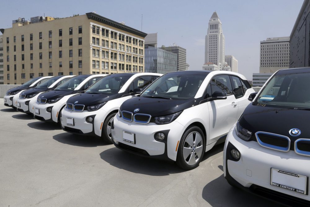 Electric cars are parked atop the Los Angeles Police Department parking lot, in Los Angeles. (Nick Ut/AP)