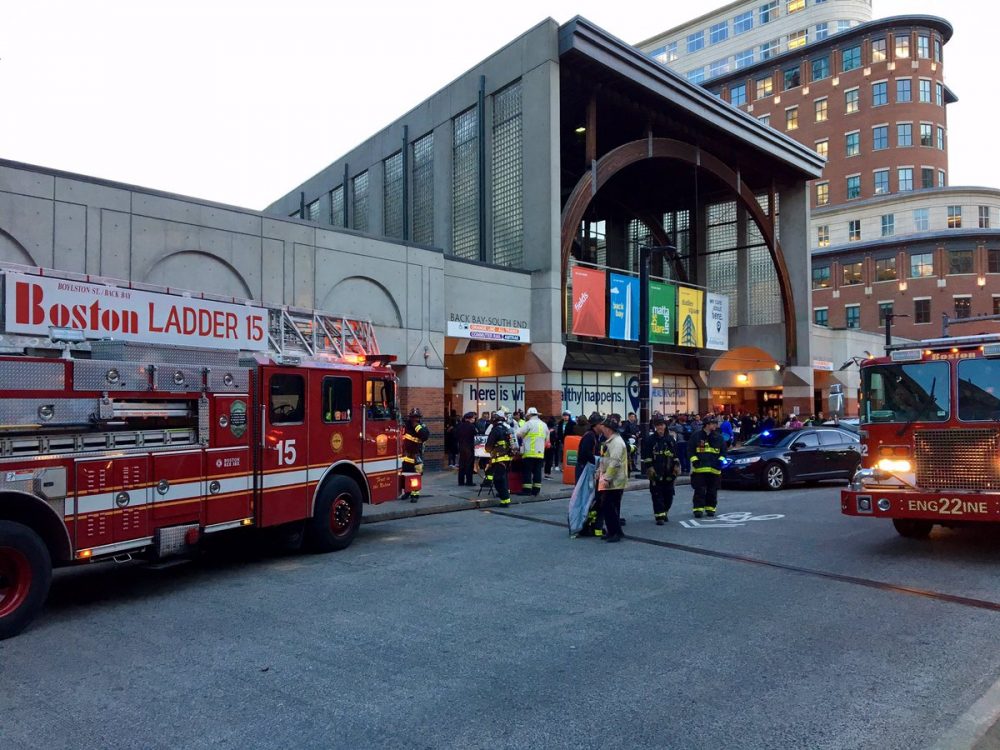 The scene outside Back Bay station Wednesday evening after a train engine's overheated and caused a fire that filled the station with smoke. (Shannon Dooling/WBUR)