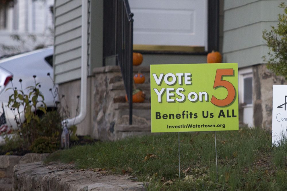 A sign in favor of adopting the Community Preservation Act is seen on Carroll Street in Watertown, one of 16 communities voting on the measure this election. (Jesse Costa/WBUR)