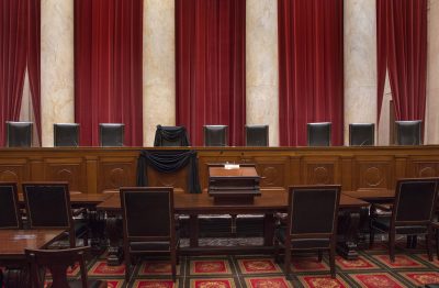 This photo provided by the Collection of the Supreme Court shows Associate Justice Antonin Scalia's bench chair and the bench in front of his seat draped in black on Feb. 16 following his death. (Franz Jantzen/Collection of the Supreme Court of the United States via AP)
