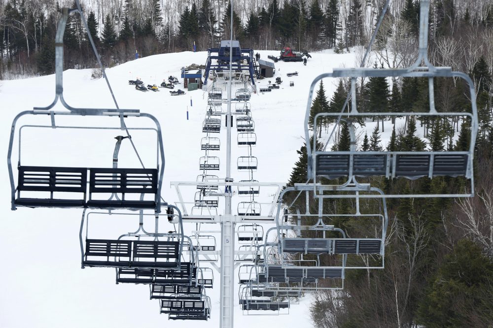 Workers repair the King Pine chairlift at Sugarloaf Mountain Ski Resort in Carrabassett Valley, Maine in March 2015. (Robert F. Bukaty/AP)