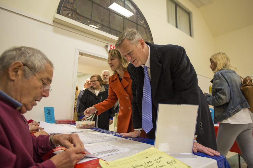 Gov. Charlie Baker checks in to receive his ballot on Election Day. (Jesse Costa/WBUR)