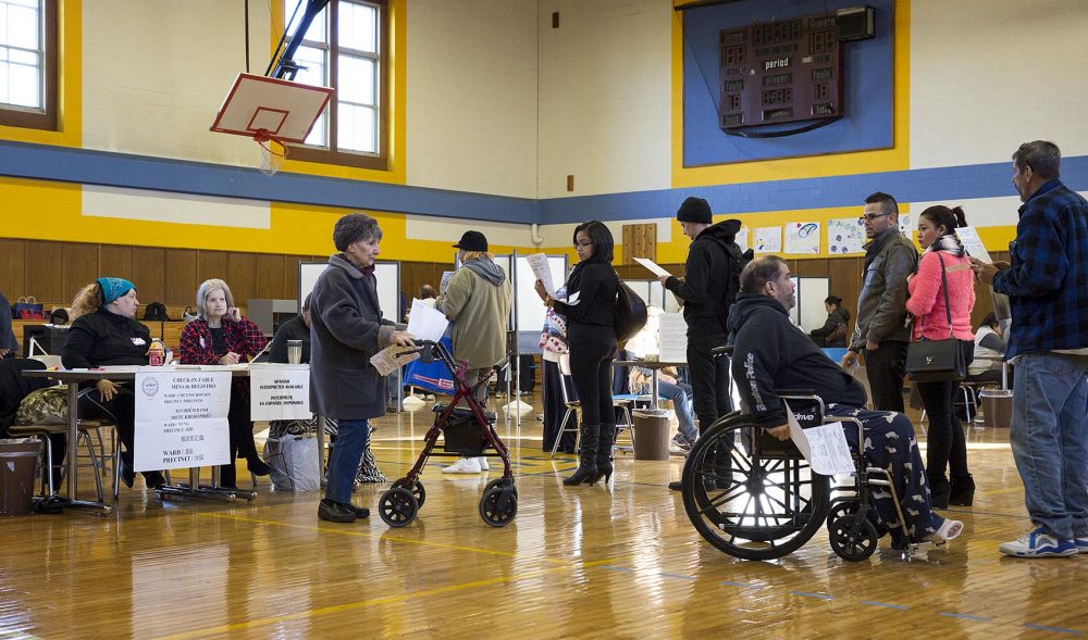 Voters wait in line to vote at East Boston High School. (Robin Lubbock/WBUR)