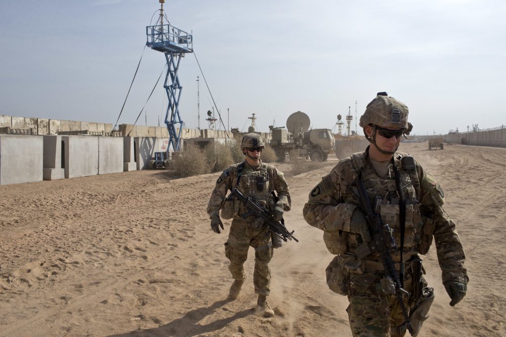 U.S. Army soldiers move through Qayara West Coalition base in Qayara, some 50 kilometers south of Mosul, Iraq, Wednesday, Nov. 9, 2016. (Marko Drobnjakovic/AP)
