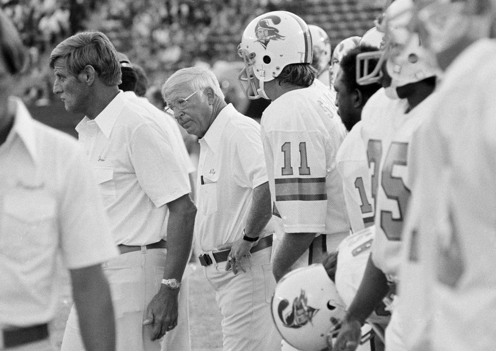 Coach John McKay and members of the 1976 Buccaneers watch as Tampa Bay loses to the Los Angeles Rams, 26-3, at the Coliseum, July 31, 1976. (George Brich/AP)