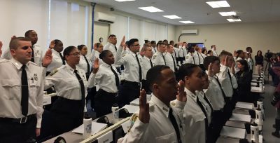 The cadets were sworn in Wednesday night. (Delores Handy/WBUR)