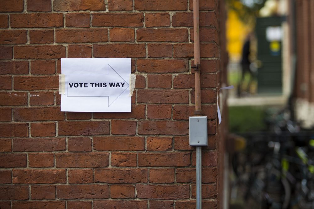 A sign shows Harvard students the direction to Phillips Brooks House, one of three polling places on campus Thursday to vote for the student union election. (Jesse Costa/WBUR)