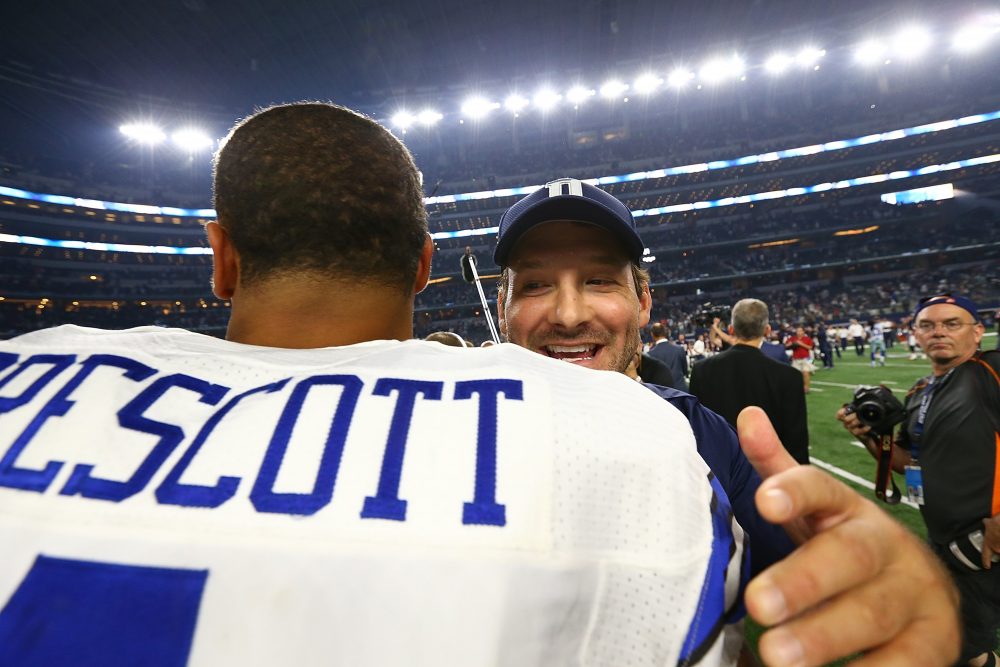 Dak Prescott of the Dallas Cowboys hugs Tony Romo after a win against the Chicago Bears at AT&T Stadium on Sept. 25, 2016 in Arlington, Texas. (Ronald Martinez/Getty Images)
