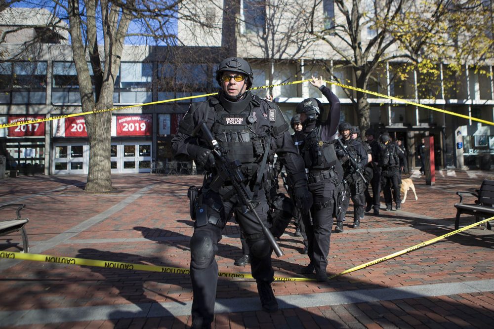 A Boston Police Department tactical unit responded to Boston University's Mugar Library Friday morning after police received a call from a man claiming to be inside the building with guns and explosives. Police found nothing and determined the call was a hoax. (Jesse Costa/WBUR)