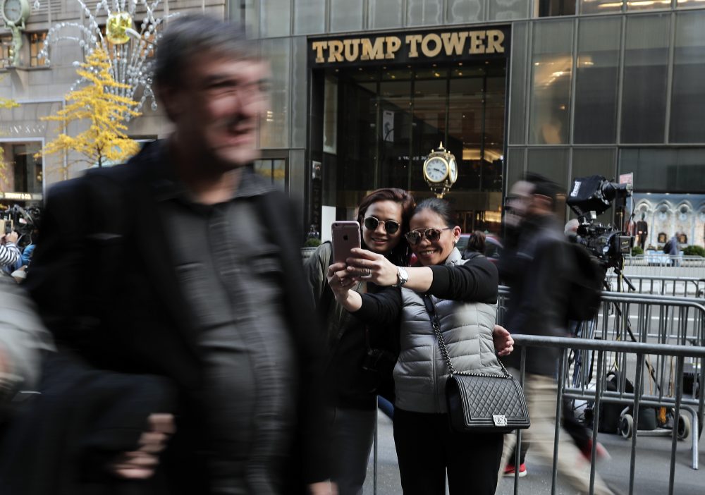 Two women stop to take a selfie from the sidewalk across the street from Trump Tower, where President-elect Donald Trump continued meetings with members of his transition team, Wednesday, Nov. 16, 2016, in New York. (Julie Jacobson/AP)