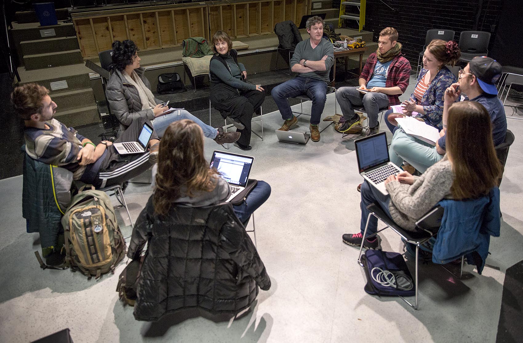 A class of theater and playwrighting students assemble inside the Boston Playwrights' Theatre. (Robin Lubbock/WBUR)