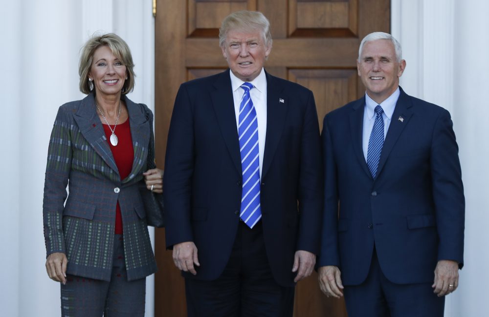 President-elect Donald Trump and Vice President-elect Mike Pence and Betsy DeVos pose for photographs at Trump National Golf Club Bedminster clubhouse in Bedminster, N.J., Saturday, Nov. 19, 2016. (Carolyn Kaster/AP)