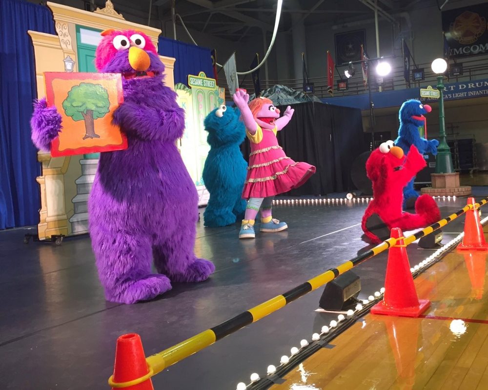 Sesame Street is taking live shows like this one, featuring the muppet Katie, a military kid who is sad about an upcoming move, to military bases around the country. (Julia Botero/NCPR)