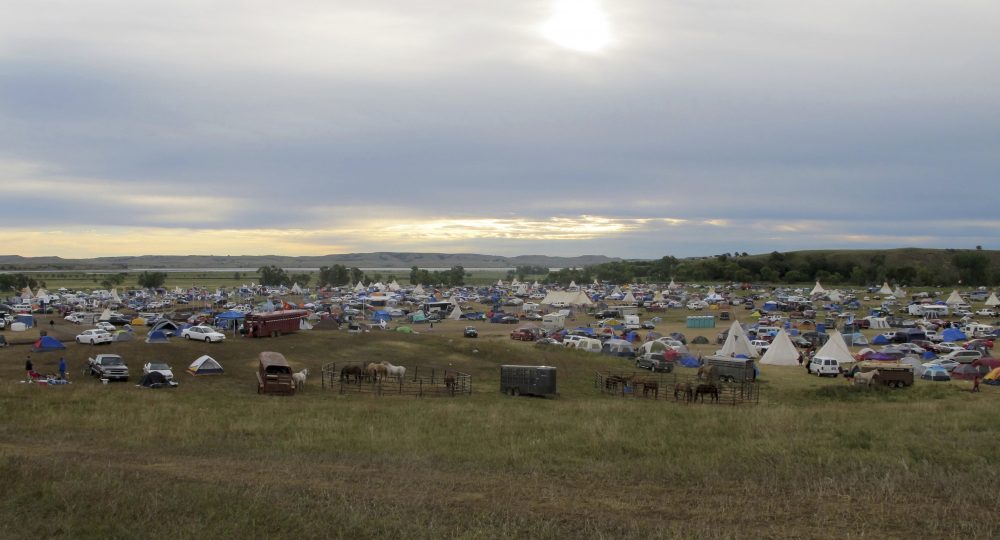 In this Sept. 9, 2016 file photo, more than a thousand people gather at an encampment near North Dakota's Standing Rock Sioux reservation. (James MacPherson/AP)