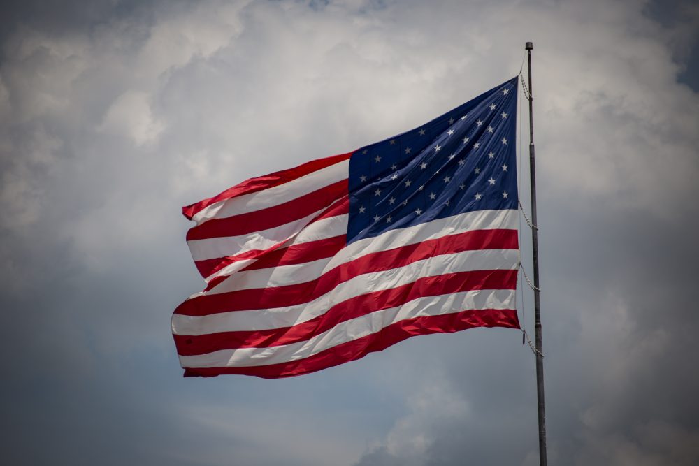 The removal of the American flag from Hampshire College's campus has generated strong reactions from community members, including veterans and students. (Jp VALERY/Unsplash)