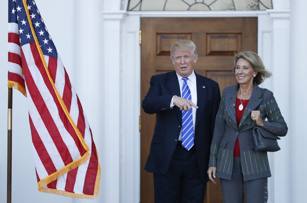 President-elect Donald Trump and Betsy DeVos, his pick for education secretary, pose for photographs at Trump National Golf Club Bedminster clubhouse in Bedminster, N.J., Saturday, Nov. 19, 2016. (Carolyn Kaster/AP)