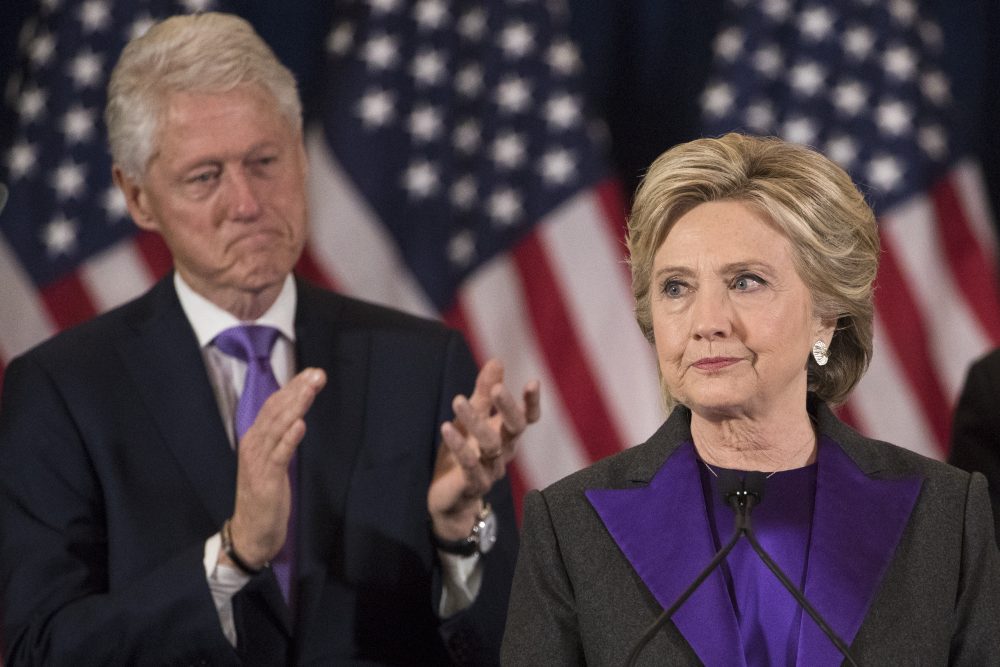 Hillary Clinton gives her concession speech on Wednesday, Nov. 9, as her husband, former President Bill Clinton, applauds behind her. (Matt Rourke/AP)