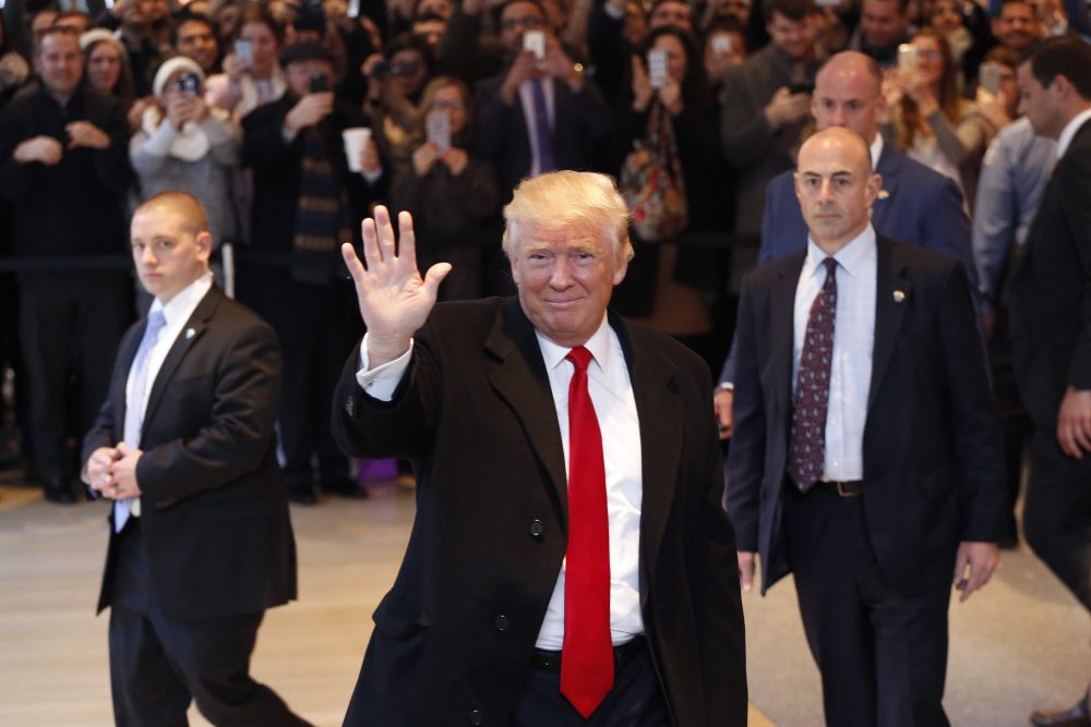 President-elect Donald Trump leaves the New York Times building Tuesday. (Mark Lennihan/AP)