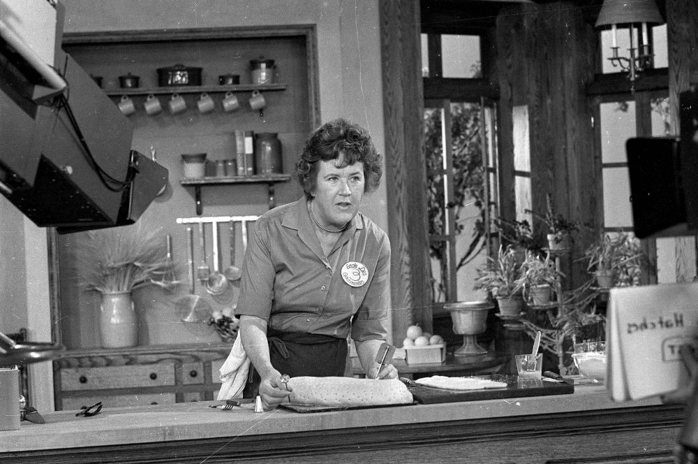 This Nov. 24, 1970 photo shows television cooking personality Julia Child preparing a French delicacy in her cooking studio. (AP Photo/FILE)