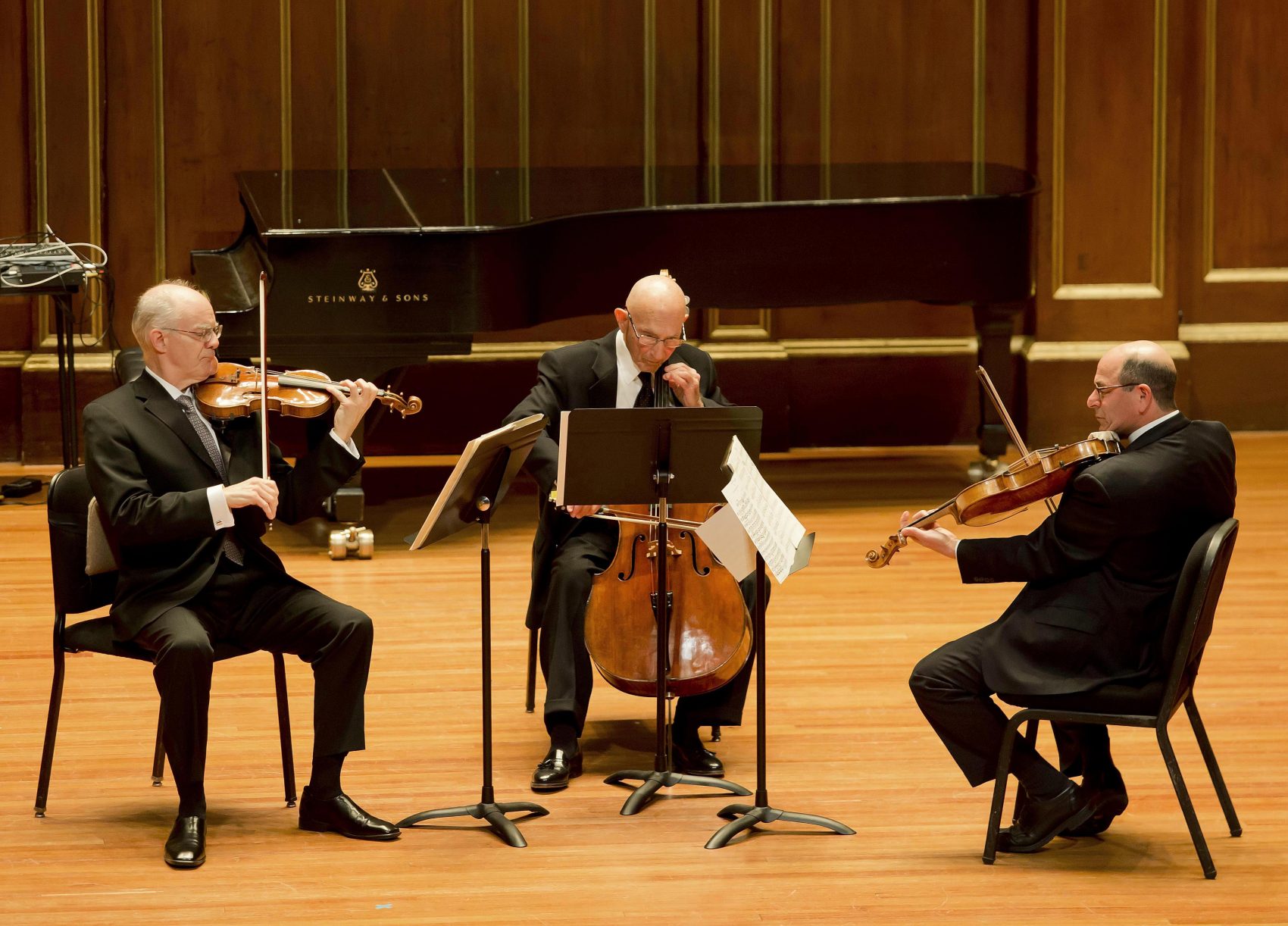 Jules Eskin performing in a Boston Symphony Orchestra concert with Malcolm Lowe (left) and Steven Ansell in 2015. (Courtesy Winslow Townson/Boston Symphony Orchestra)