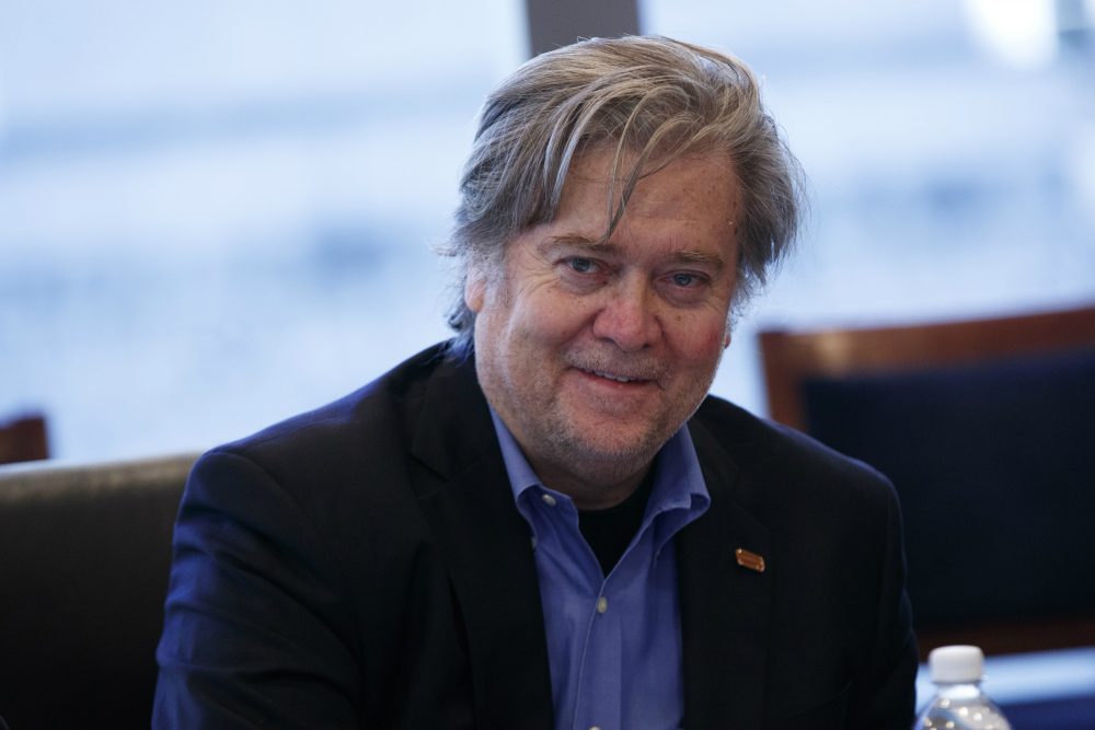 His audience is large, writes Alex Green, and they represent a threat to the values of a democracy.
Pictured: Steve Bannon, campaign CEO for Republican presidential candidate Donald Trump and the president-elect's pick for chief strategist and senior counsel, looks on during a national security meeting with advisors at Trump Tower, Friday, Oct. 7, 2016, in New York. (Evan Vucci/AP)